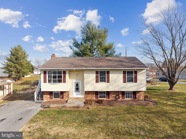 bi-level home with a front yard