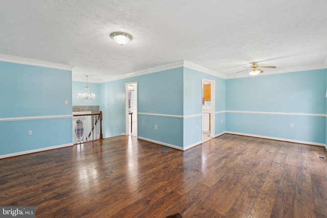 spare room with a textured ceiling, ceiling fan with notable chandelier, crown molding, and dark wood-type flooring