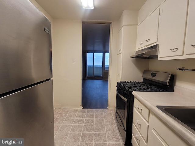 kitchen with white cabinets and appliances with stainless steel finishes