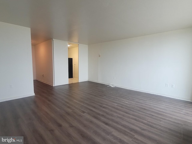 empty room featuring dark hardwood / wood-style floors