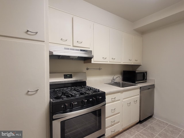 kitchen featuring sink, white cabinets, and appliances with stainless steel finishes