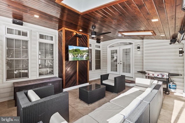 view of patio with ceiling fan, french doors, and an outdoor living space