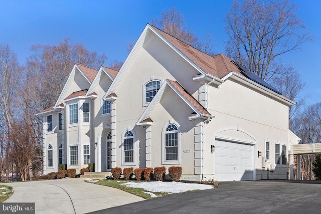 front of property with a garage