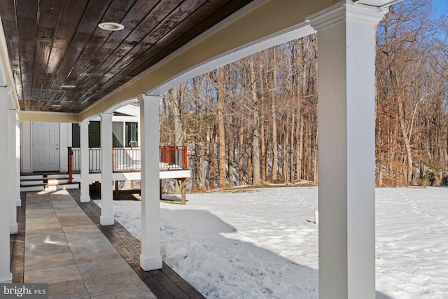 view of snow covered patio