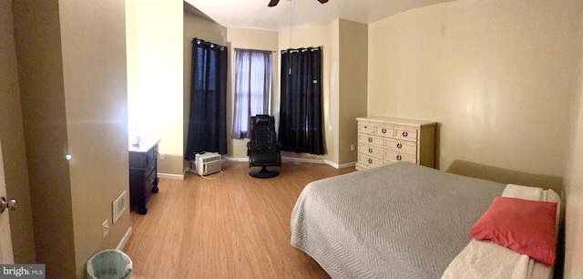 bedroom featuring ceiling fan and hardwood / wood-style flooring