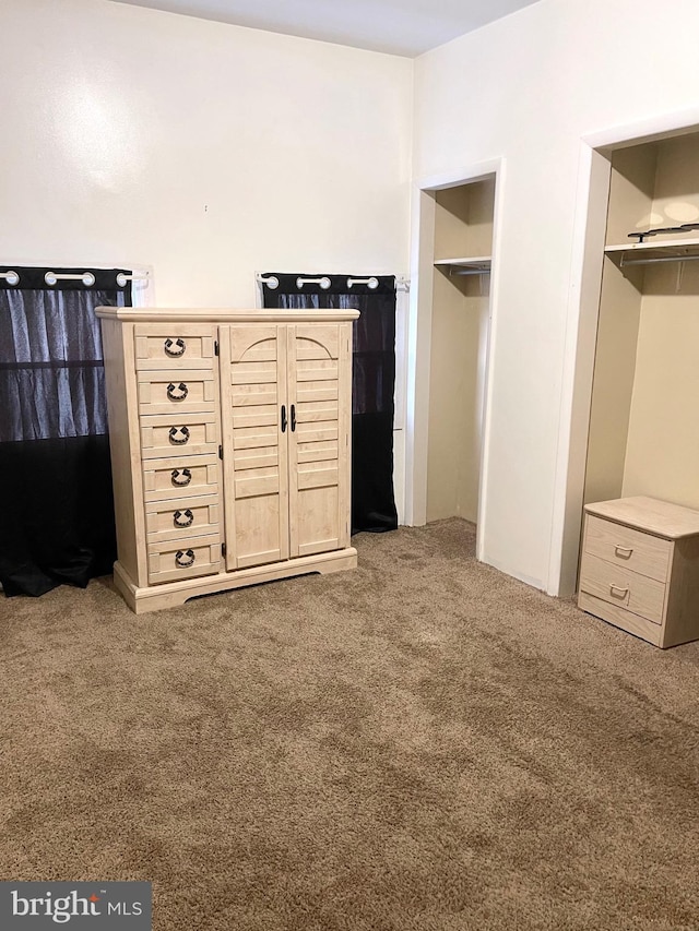 unfurnished bedroom with carpet