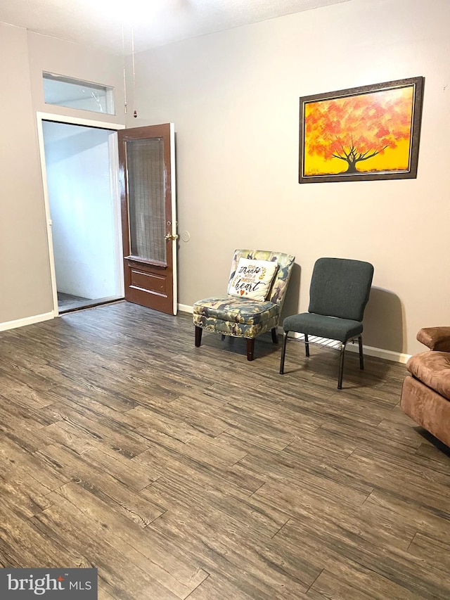 sitting room featuring dark hardwood / wood-style flooring