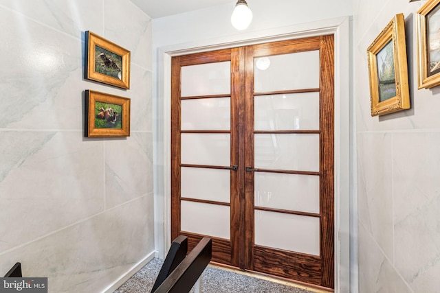 entryway featuring carpet and french doors