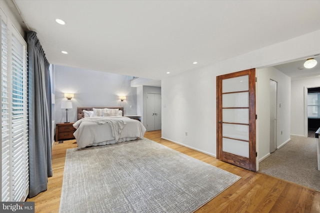 bedroom with light hardwood / wood-style flooring