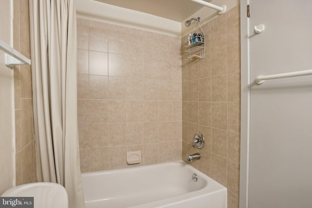 bathroom with shower / bathtub combination with curtain