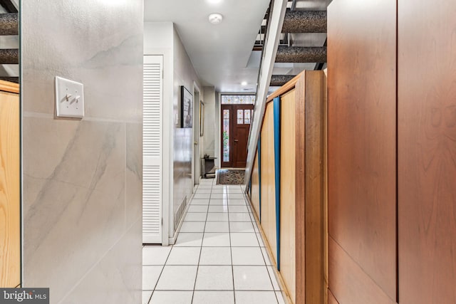 hallway with light tile patterned floors