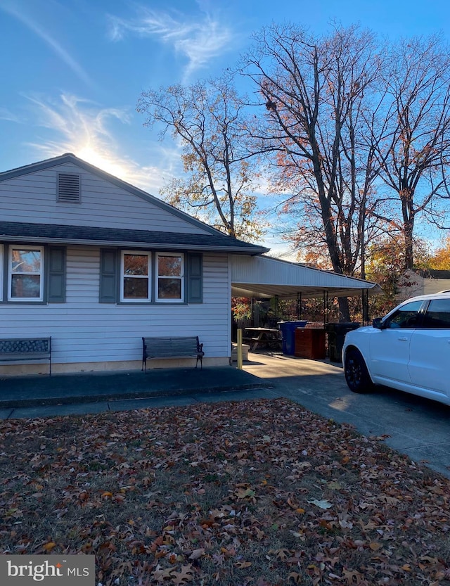 view of home's exterior with a carport