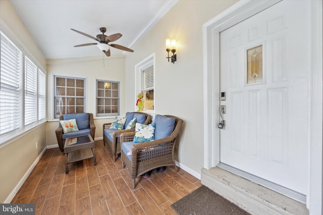 entrance to property featuring ceiling fan and a porch