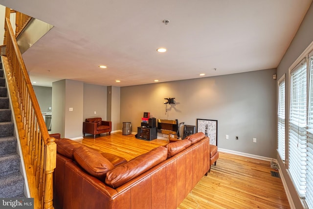 863 Barnaby St SE, Washington, DC 20032 - living area featuring stairs, light wood-style floors, and recessed lighting