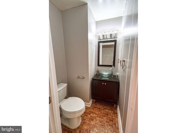 863 Barnaby St SE, Washington, DC 20032 - half bathroom with vanity and brick patterned floors