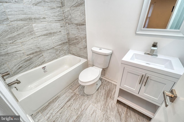 full bathroom with vanity, toilet, and tiled shower / bath