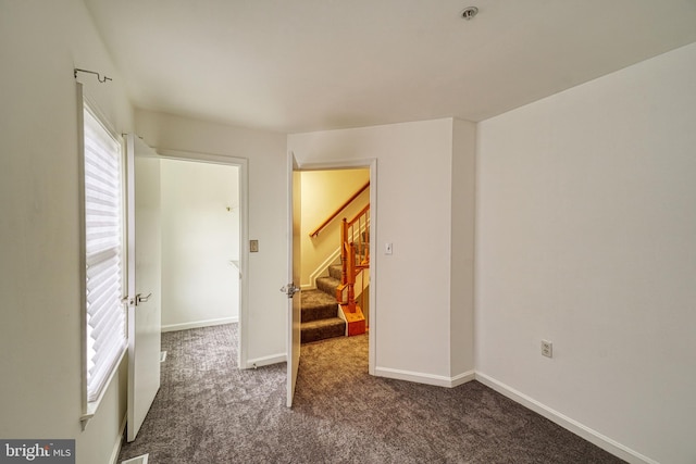 863 Barnaby St SE, Washington, DC 20032 - empty room with carpet flooring, stairway, and a pendent fire sprinkler