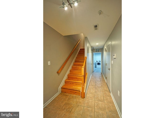 863 Barnaby St SE, Washington, DC 20032 - stairway with baseboards and tile patterned flooring