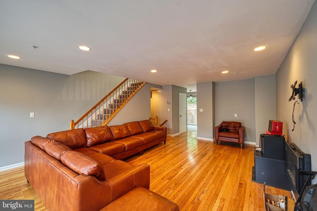 863 Barnaby St SE, Washington, DC 20032 - living room featuring light wood-style floors, recessed lighting, and stairway