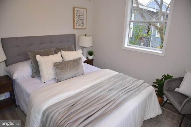 bedroom featuring dark hardwood / wood-style flooring