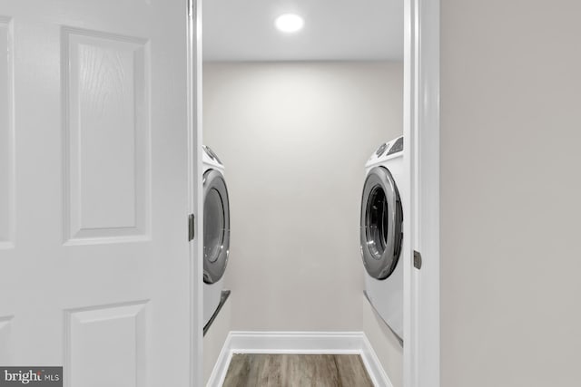 laundry area featuring hardwood / wood-style floors