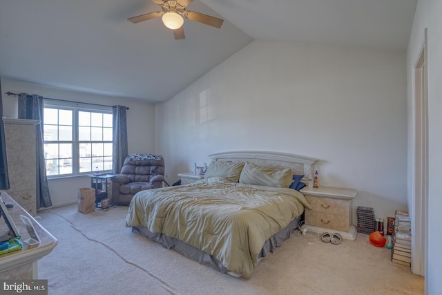 bedroom with ceiling fan, carpet, and vaulted ceiling