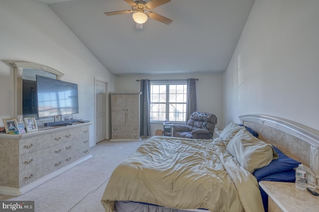 bedroom featuring ceiling fan, light carpet, and vaulted ceiling