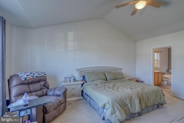 bedroom with connected bathroom, light colored carpet, ceiling fan, and lofted ceiling