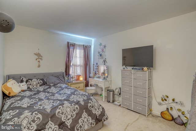 bedroom with light carpet