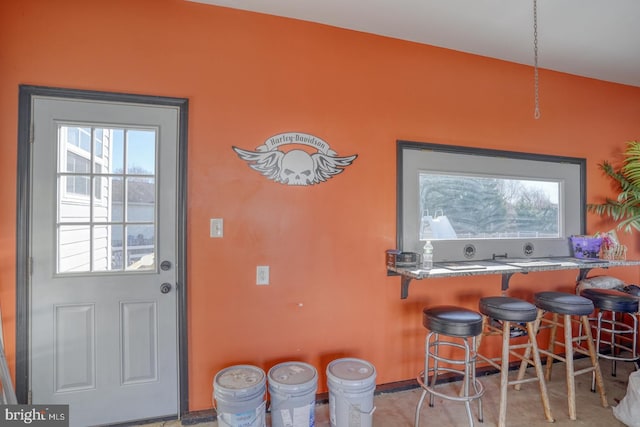 interior space featuring a kitchen bar