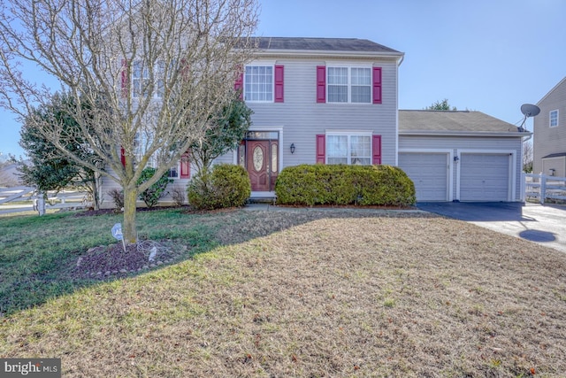 view of front of property with a garage and a front yard