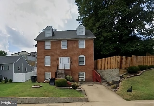 view of front of home with a front lawn