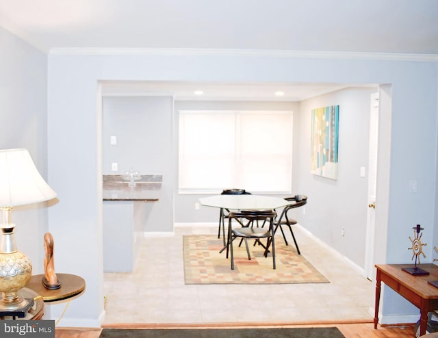 dining area with crown molding