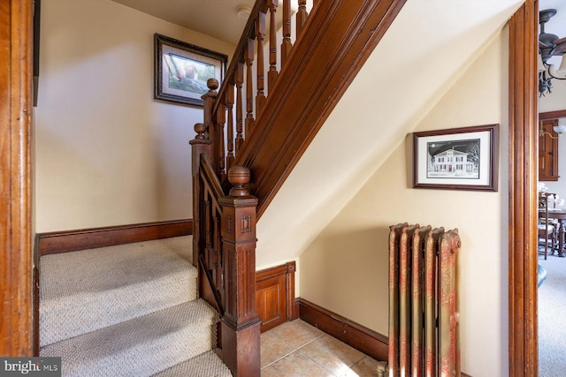 staircase with tile patterned flooring