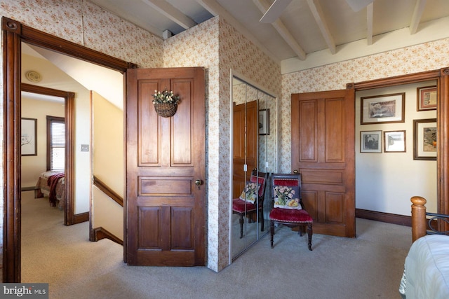 interior space featuring vaulted ceiling with beams