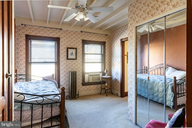 bedroom featuring carpet flooring, ceiling fan, cooling unit, and beam ceiling