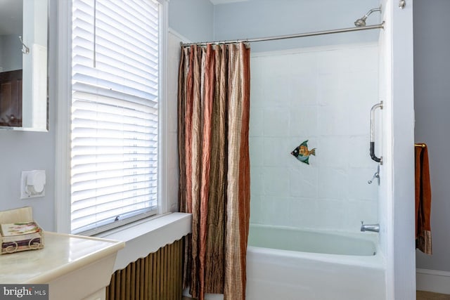 bathroom with shower / tub combo