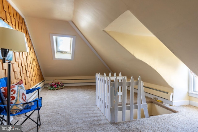 additional living space featuring carpet flooring and lofted ceiling