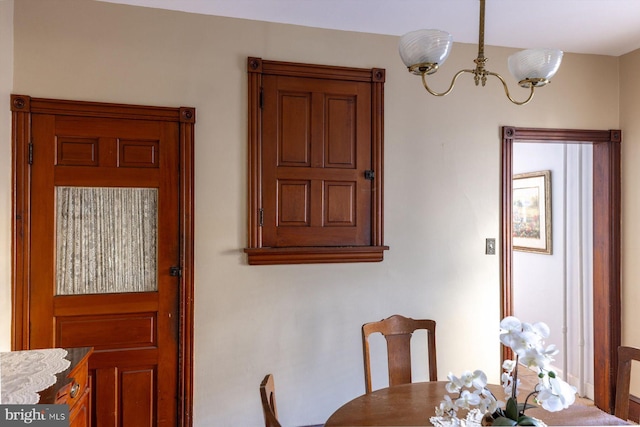 dining area featuring a chandelier