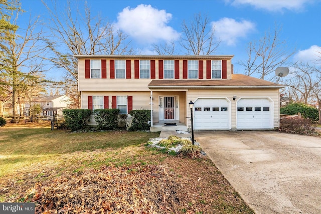 view of front of house with a front yard and a garage