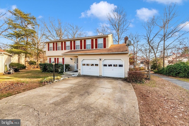 view of front of property with a garage and a front lawn