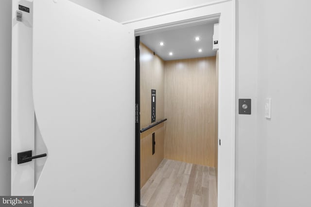 room details featuring hardwood / wood-style floors and elevator