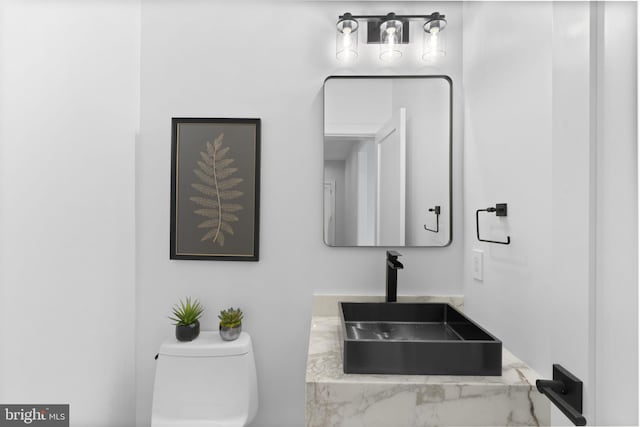 bathroom with toilet and sink