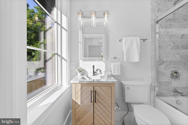 full bathroom with vanity, toilet, and enclosed tub / shower combo