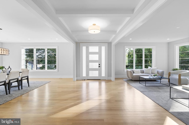 entryway with beamed ceiling and light hardwood / wood-style flooring