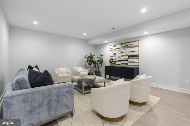 living room with light hardwood / wood-style flooring