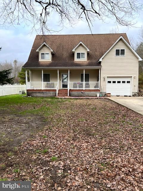 view of front of home with a porch and a garage