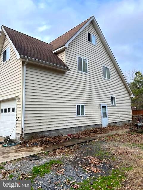 view of home's exterior with a garage