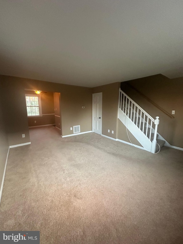 unfurnished living room with carpet flooring