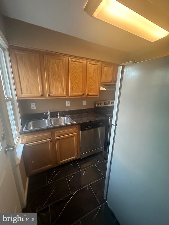 kitchen featuring appliances with stainless steel finishes and sink